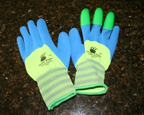 Badger Claw gardening gloves on a counter. 
