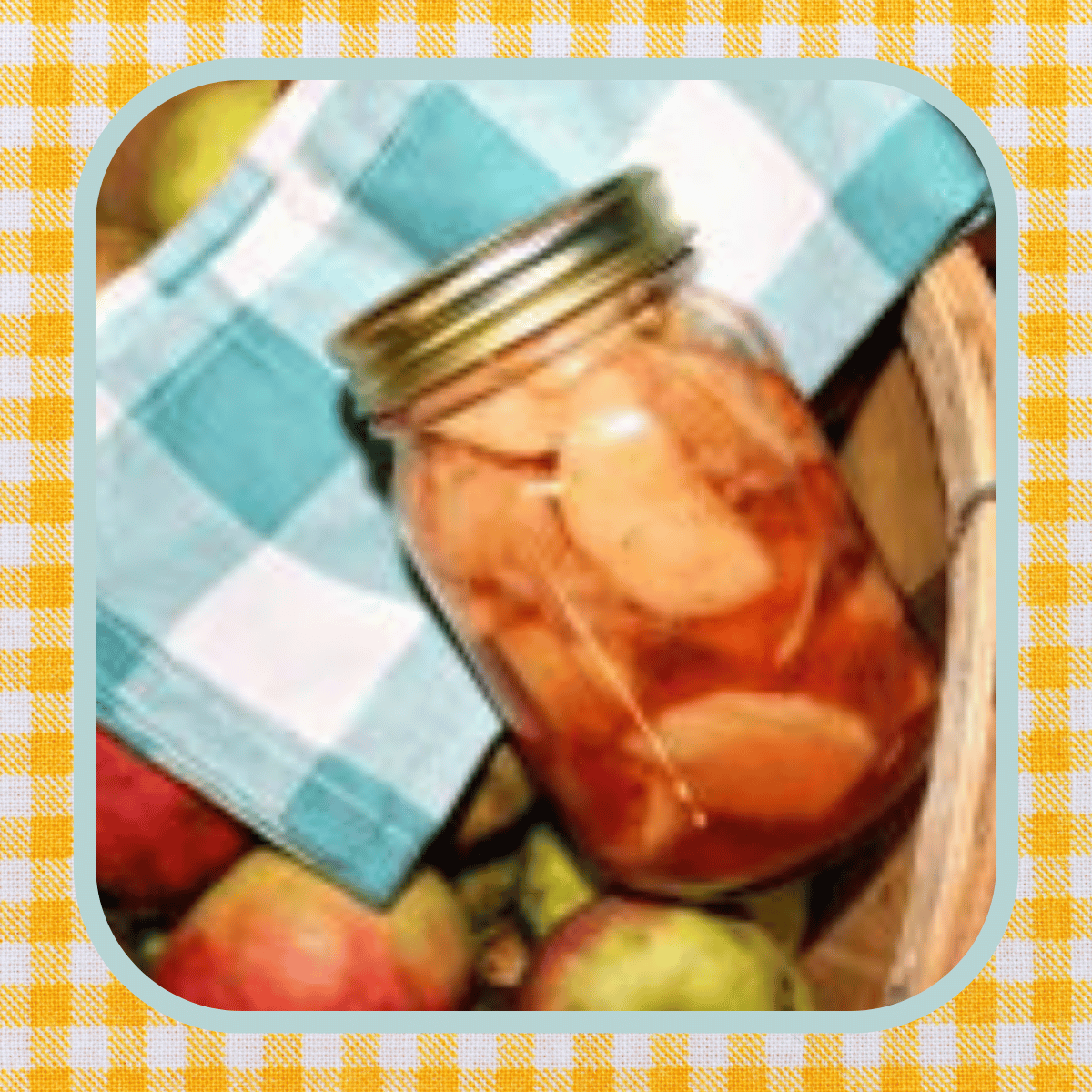 a jar of spiced apples against a blue gingham napkin