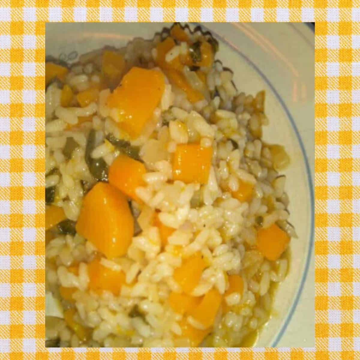 a plate of butternut squash risotto against a yellow gingham napkin
