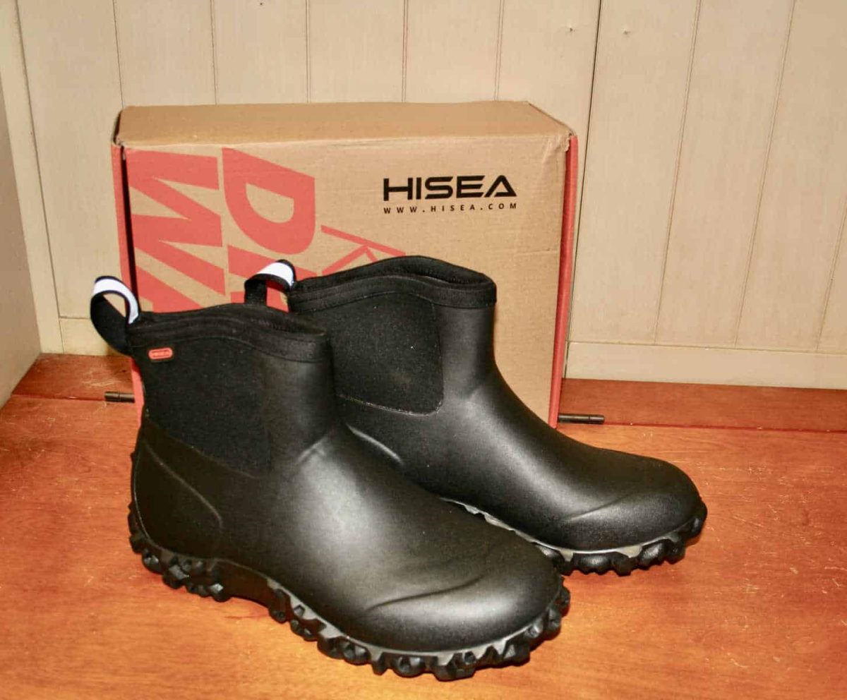 Hisea black ankle boots and a box on a bench