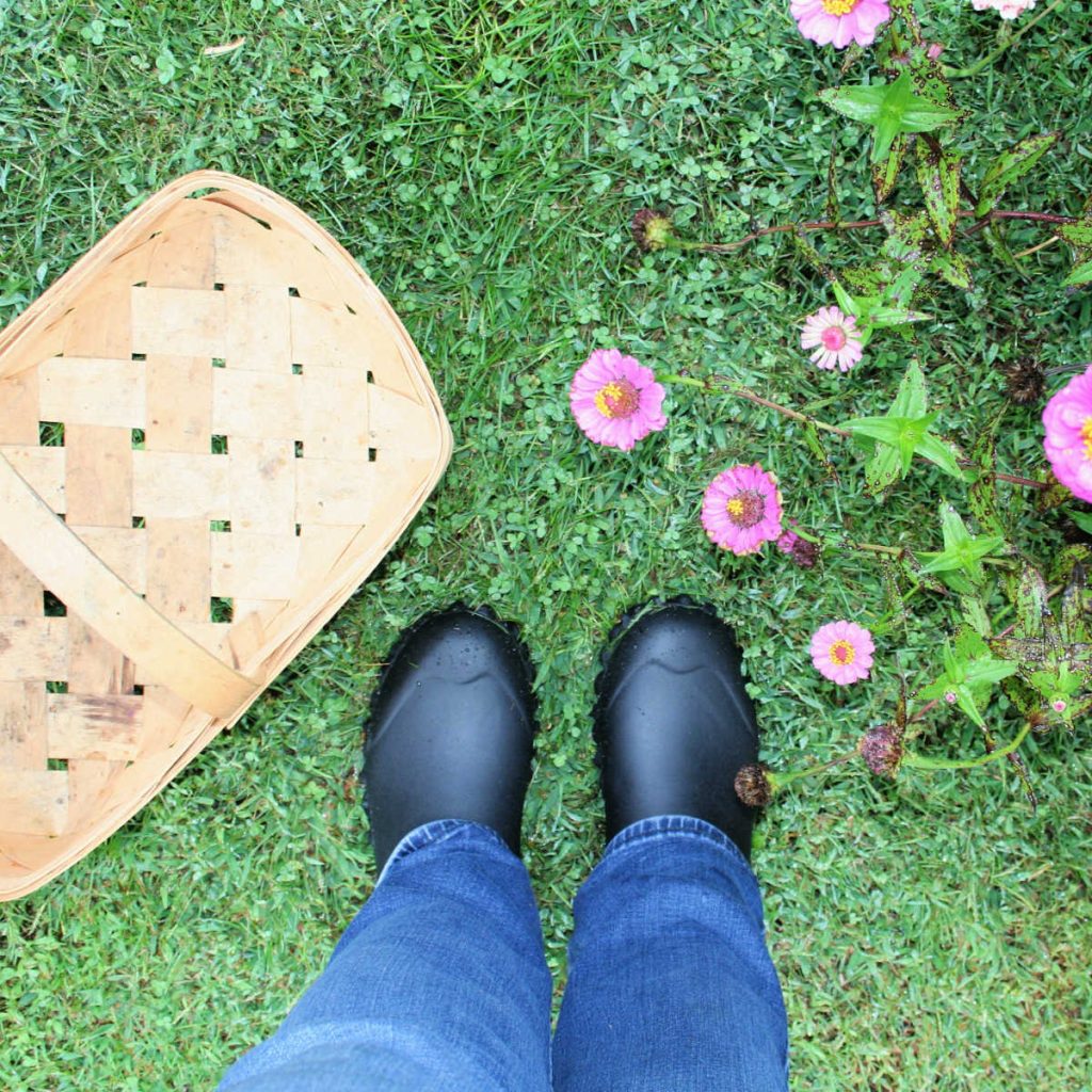 looking down at a pair of Hisea gardening boots on the lawn
