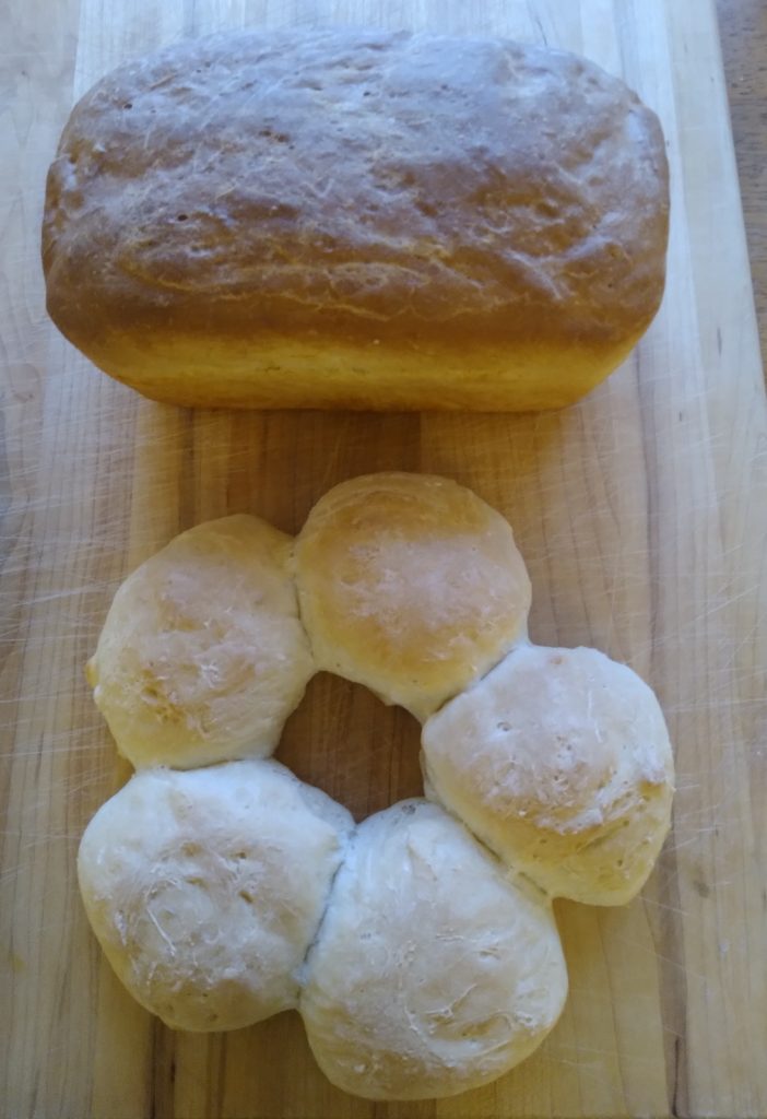 a loaf of bread and ring of rolls
