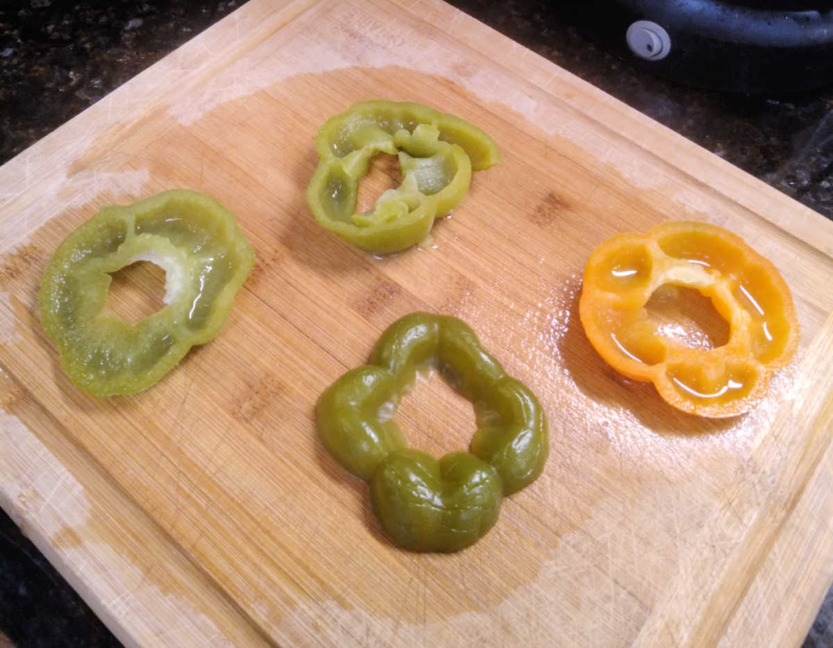 cut the tops off the peppers to make natural covers for the stuffed peppers without rice as they bake