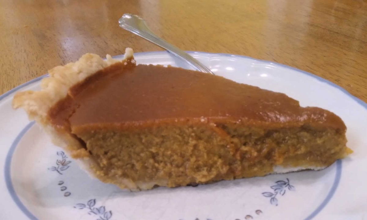 a slice of homemade pumpkin pie