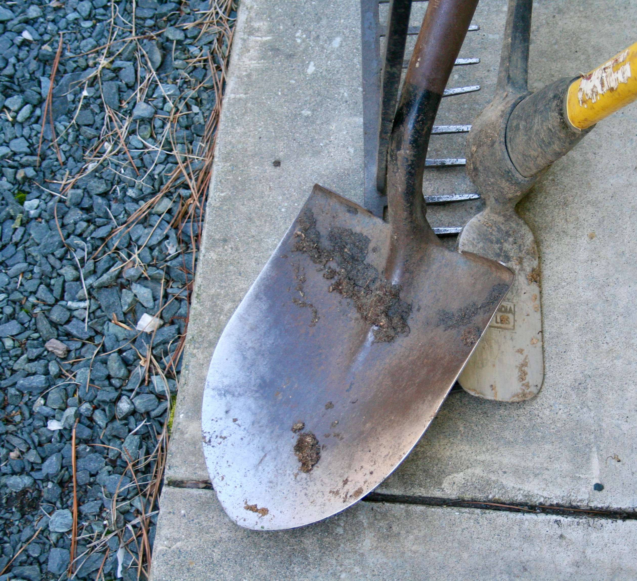shovel, pick axe, and rake