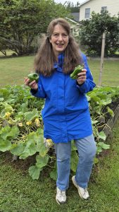 Writer, marketing expert, gardening expert Jeanne Grunert holding peppers